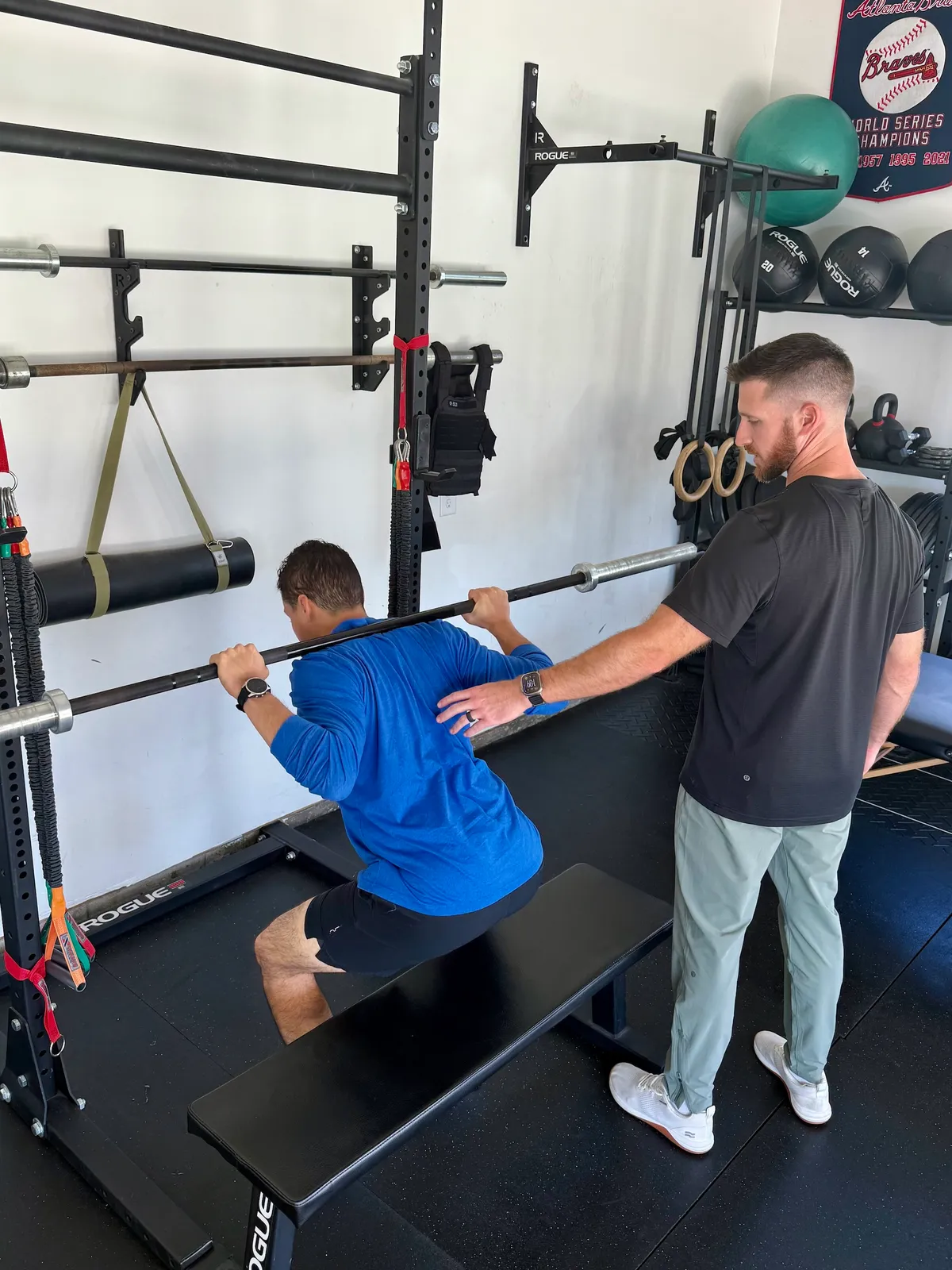 Ryan Summitt cueing a patient through a squat pattern